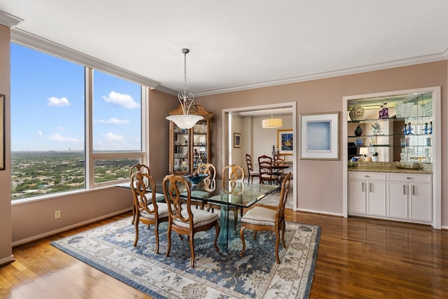 5100 San Felipe St Unit 353, Houston, TX 77056 - dining room featuring dark wood-style flooring and crown molding