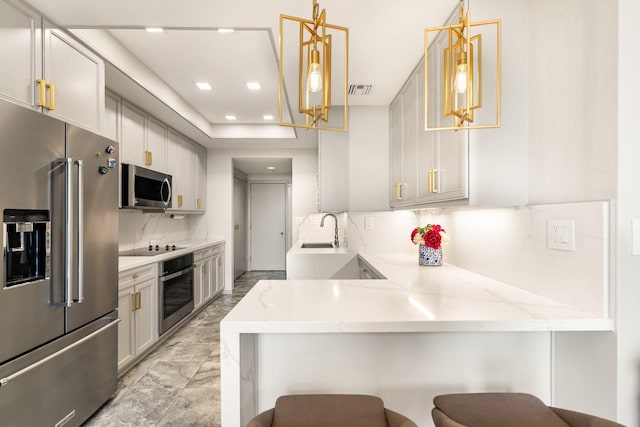 5100 San Felipe St Unit 353, Houston, TX 77056 - kitchen featuring stainless steel appliances, a peninsula, recessed lighting, tasteful backsplash, and light stone counters