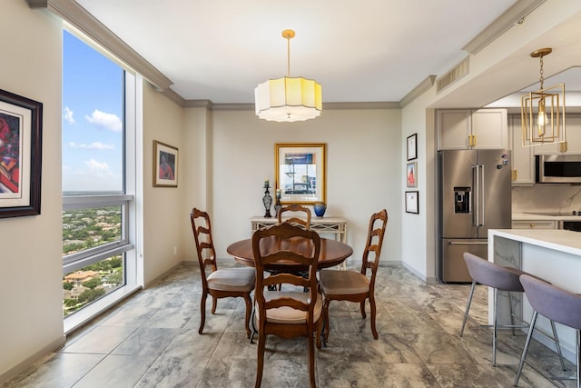 5100 San Felipe St Unit 353, Houston, TX 77056 - dining area featuring ornamental molding and light stone finish flooring