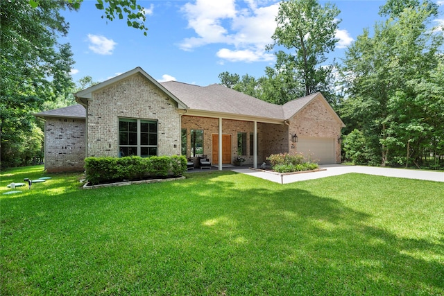 25010 Butler Hill Ct, Tomball, TX 77375 - single story home featuring brick siding, a front yard, and an attached garage
