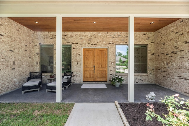25010 Butler Hill Ct, Tomball, TX 77375 - property entrance with a patio and brick siding