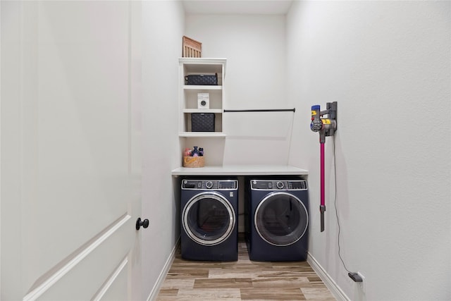 25010 Butler Hill Ct, Tomball, TX 77375 - laundry area with separate washer and dryer and light wood-type flooring