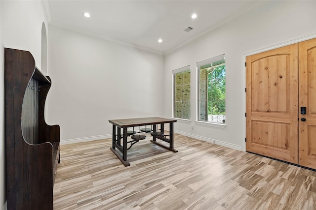 25010 Butler Hill Ct, Tomball, TX 77375 - foyer with light wood-style floors, crown molding, recessed lighting, and arched walkways