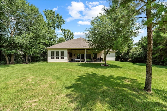 25010 Butler Hill Ct, Tomball, TX 77375 - back of property with a yard and a patio