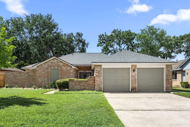 6114 Elkwood Forest Dr, Houston, TX 77088 - view of front facade with an attached garage, driveway, a shingled roof, and brick siding