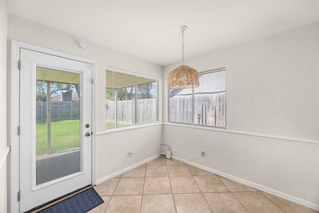 6114 Elkwood Forest Dr, Houston, TX 77088 - unfurnished dining area with healthy amount of natural light and light tile patterned floors