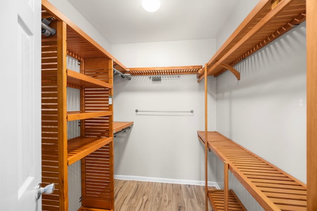 6114 Elkwood Forest Dr, Houston, TX 77088 - walk in closet featuring wood finished floors