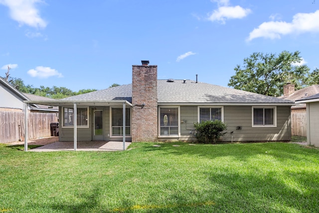 6114 Elkwood Forest Dr, Houston, TX 77088 - back of property with a shingled roof, a chimney, a sunroom, and a patio