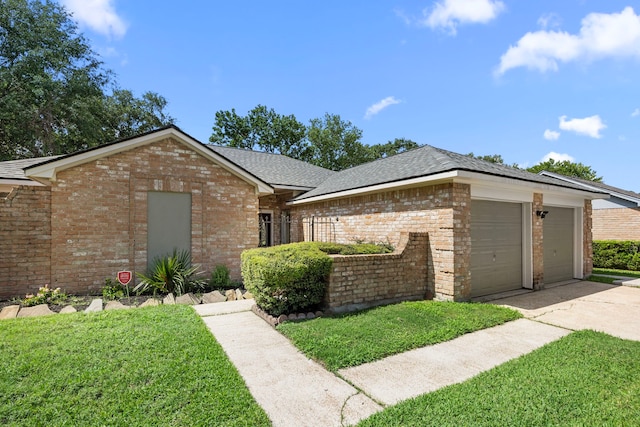 6114 Elkwood Forest Dr, Houston, TX 77088 - view of front of home featuring a garage, concrete driveway, brick siding, a front yard, and roof with shingles