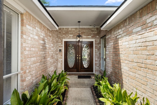 6114 Elkwood Forest Dr, Houston, TX 77088 - property entrance with brick siding and french doors