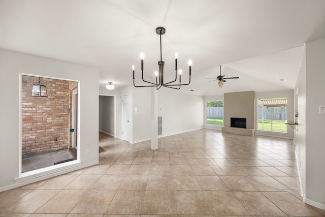 6114 Elkwood Forest Dr, Houston, TX 77088 - unfurnished living room with a chandelier, a ceiling fan, a fireplace, light tile patterned floors, and vaulted ceiling