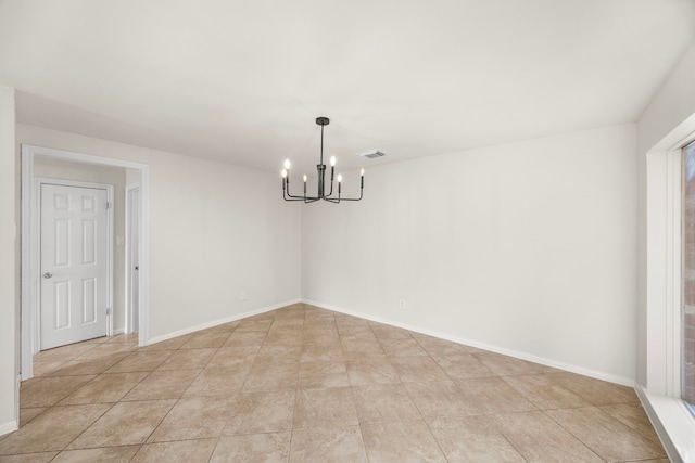 6114 Elkwood Forest Dr, Houston, TX 77088 - empty room with a chandelier and light tile patterned flooring
