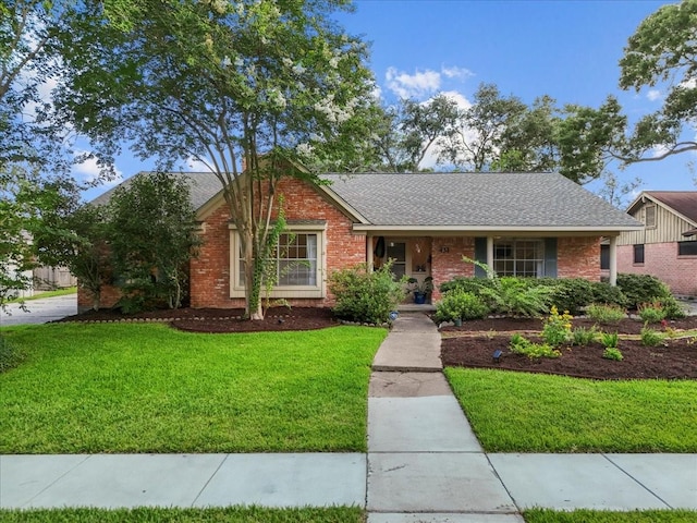 431 Shadow Creek Dr, El Lago, TX 77586 - ranch-style house featuring a front yard, brick siding, a porch, and a shingled roof