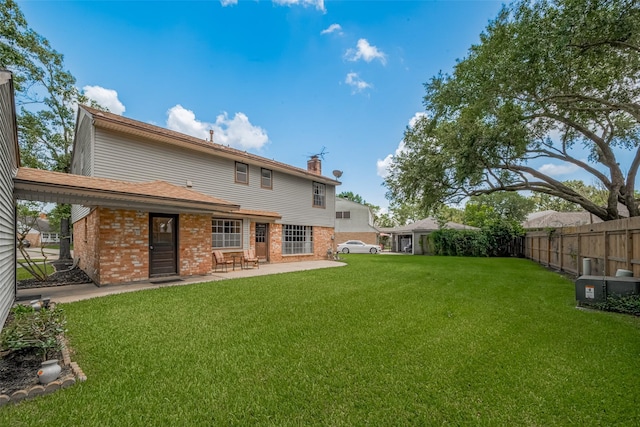 1015 Devonport Ln, Seabrook, TX 77586 - rear view of property with brick siding, a chimney, and a patio