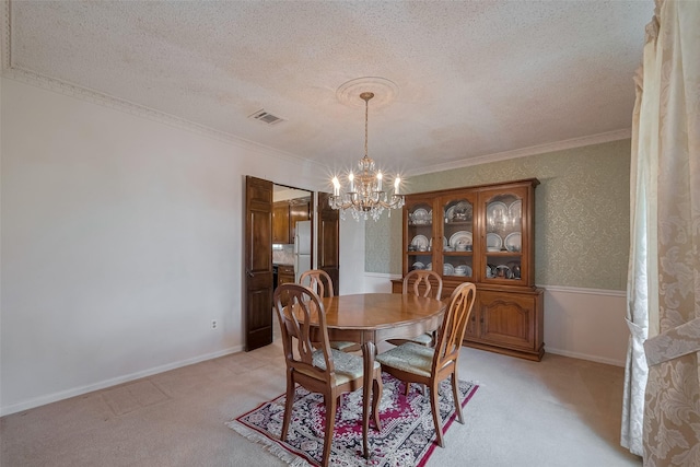 1015 Devonport Ln, Seabrook, TX 77586 - dining area featuring a chandelier, light colored carpet, a textured ceiling, and ornamental molding