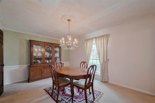 1015 Devonport Ln, Seabrook, TX 77586 - dining area with a textured ceiling, a chandelier, ornamental molding, and light colored carpet