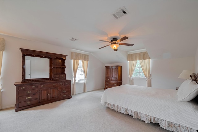 1015 Devonport Ln, Seabrook, TX 77586 - bedroom with vaulted ceiling, light carpet, and a ceiling fan