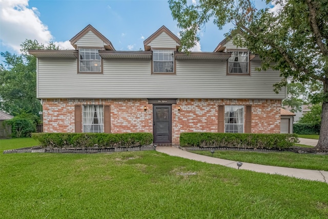 1015 Devonport Ln, Seabrook, TX 77586 - view of front of home featuring brick siding and a front yard