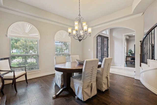 4314 Madera Creek Ln, Katy, TX 77494 - dining room featuring arched walkways, stairway, a chandelier, dark wood finished floors, and a raised ceiling