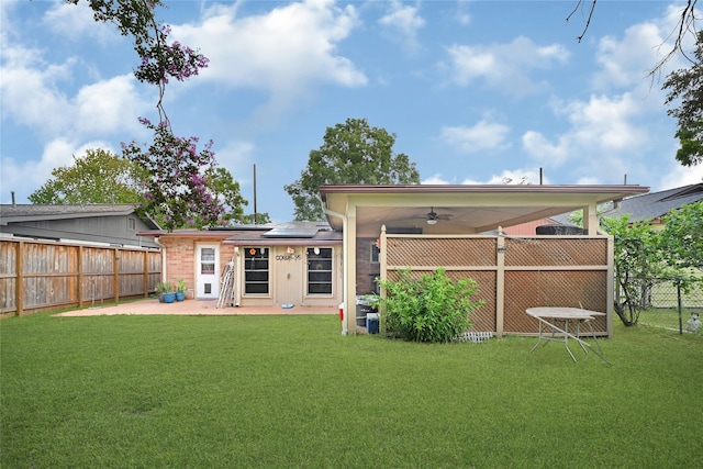 1012 Joyce St, Houston, TX 77009 - rear view of house featuring solar panels, a ceiling fan, a patio, and a fenced backyard