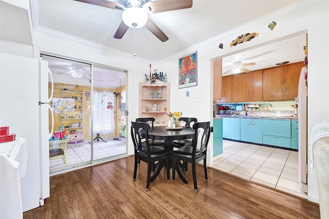 1012 Joyce St, Houston, TX 77009 - dining room featuring a ceiling fan, light wood-type flooring, and ornamental molding