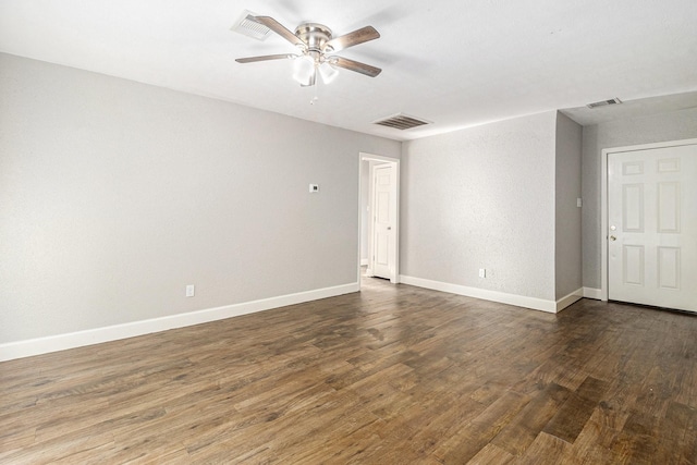 5715 Willow Glen Dr, Houston, TX 77033 - spare room with a ceiling fan and dark wood-style flooring