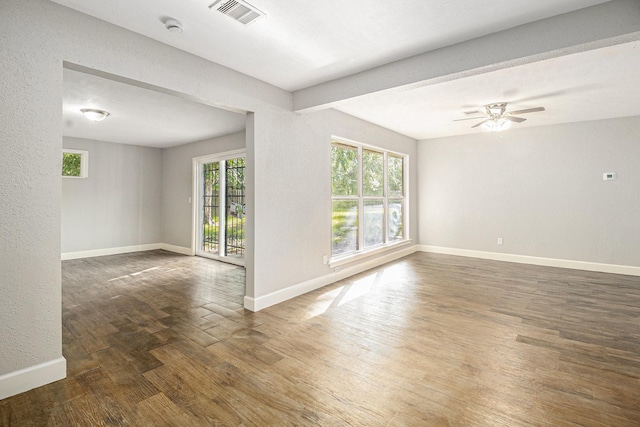 5715 Willow Glen Dr, Houston, TX 77033 - empty room featuring wood finished floors, a smoke detector, and ceiling fan