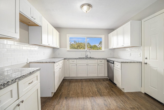 5715 Willow Glen Dr, Houston, TX 77033 - kitchen featuring dishwasher, light stone counters, decorative backsplash, dark wood-style flooring, and white cabinetry