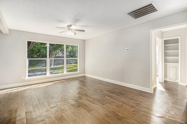 5715 Willow Glen Dr, Houston, TX 77033 - spare room featuring a ceiling fan and wood finished floors