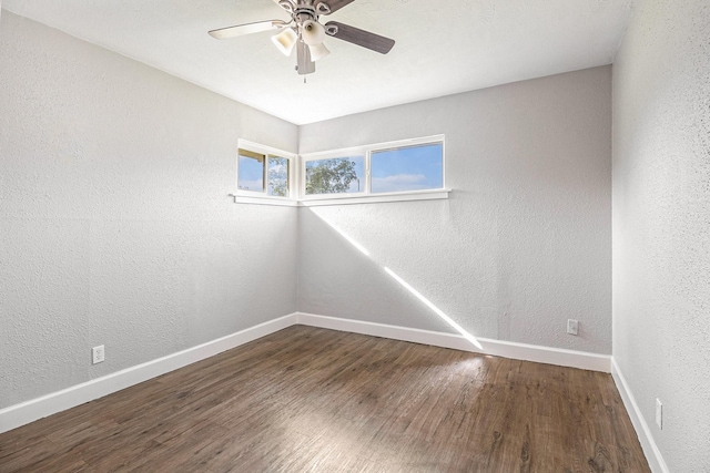 5715 Willow Glen Dr, Houston, TX 77033 - spare room featuring wood finished floors, a ceiling fan, and a textured wall