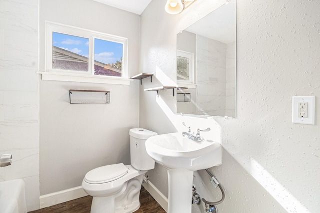 5715 Willow Glen Dr, Houston, TX 77033 - bathroom with wood finished floors and toilet