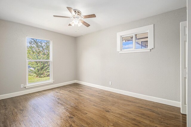 5715 Willow Glen Dr, Houston, TX 77033 - unfurnished room featuring plenty of natural light, a ceiling fan, and wood finished floors