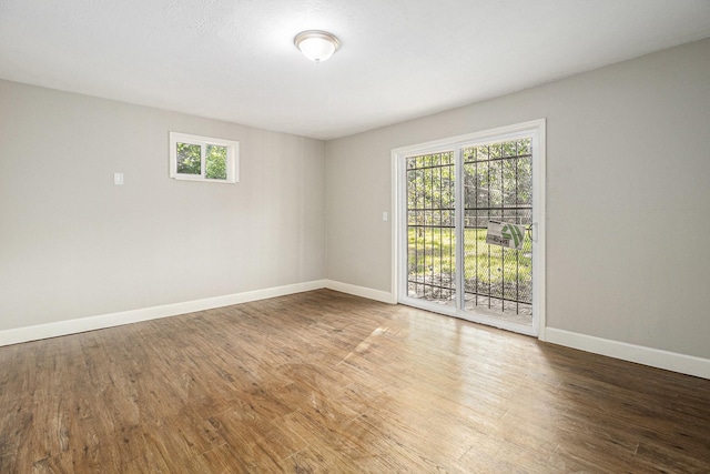 5715 Willow Glen Dr, Houston, TX 77033 - empty room with plenty of natural light and wood finished floors