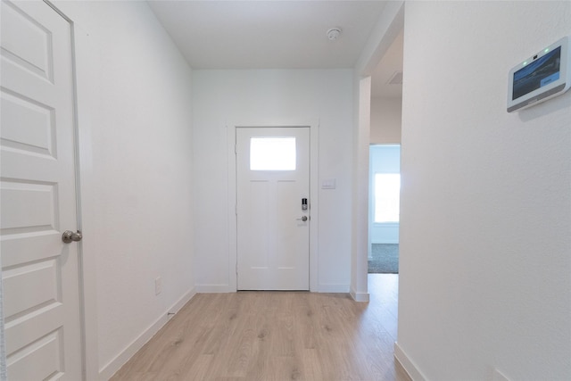 30030 Foxtail Pine Ct, Katy, TX 77494 - doorway to outside featuring light wood-type flooring and baseboards