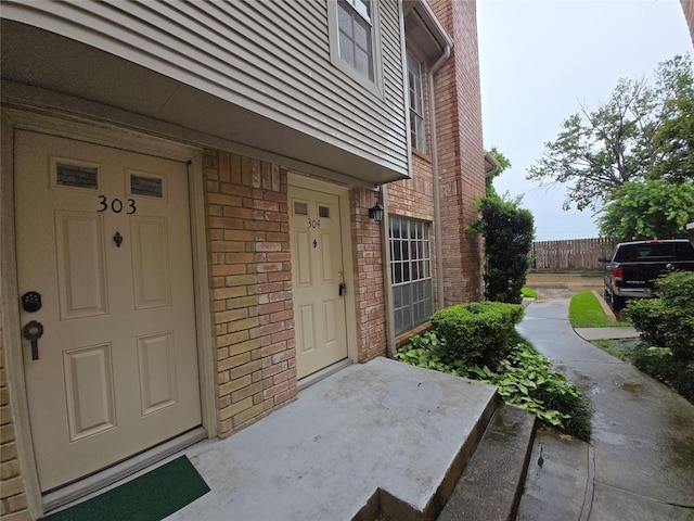 3100 Jeanetta St Unit 304, Houston, TX 77063 - view of exterior entry with brick siding