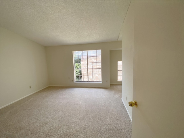 3100 Jeanetta St Unit 304, Houston, TX 77063 - empty room with carpet flooring and a textured ceiling