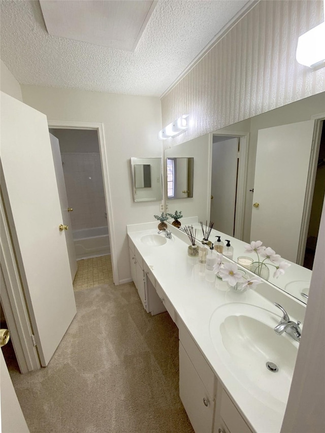 3100 Jeanetta St Unit 304, Houston, TX 77063 - full bathroom featuring double vanity, a textured ceiling, and tub / shower combination