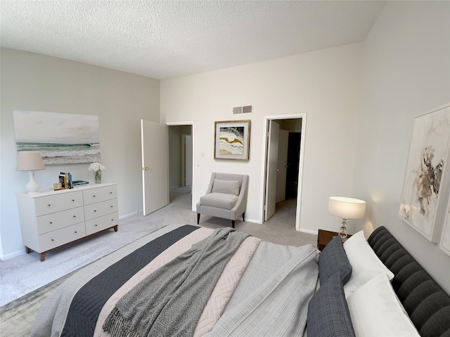 3100 Jeanetta St Unit 304, Houston, TX 77063 - bedroom with light carpet and a textured ceiling