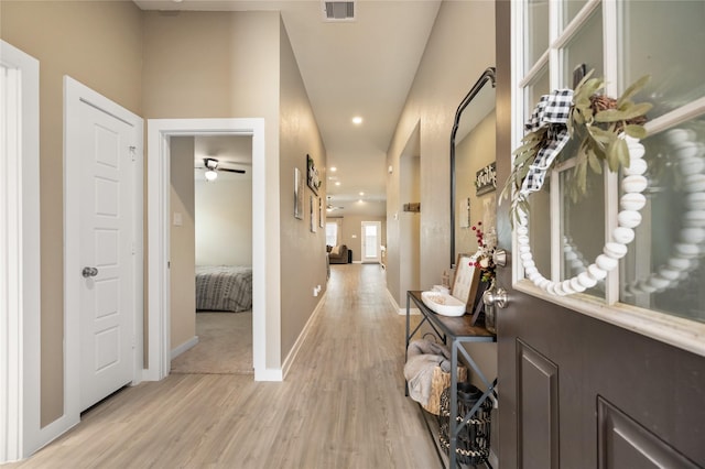2426 Gentle Breeze Ln, Baytown, TX 77523 - hallway with light wood-style floors and recessed lighting