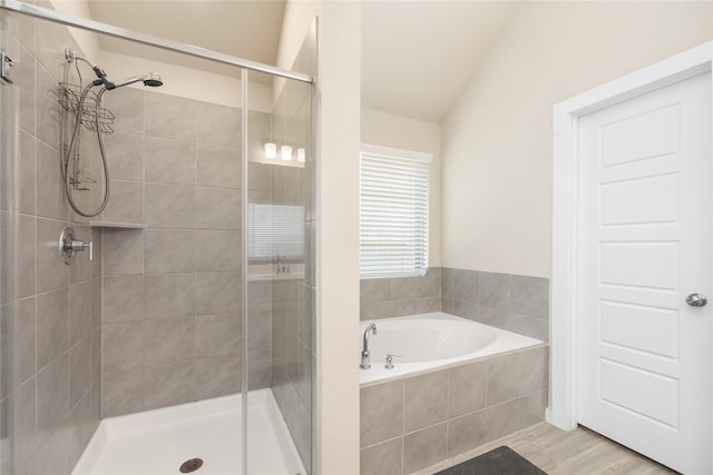 2426 Gentle Breeze Ln, Baytown, TX 77523 - full bathroom featuring a shower stall, a bath, vaulted ceiling, and wood finished floors