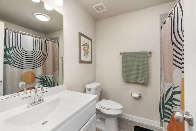 2426 Gentle Breeze Ln, Baytown, TX 77523 - full bathroom featuring vanity, wood finished floors, and a shower with curtain