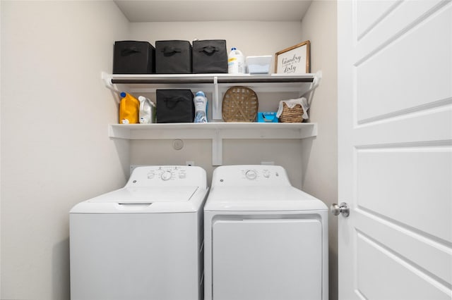 2426 Gentle Breeze Ln, Baytown, TX 77523 - laundry area with washer and clothes dryer