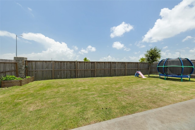 2426 Gentle Breeze Ln, Baytown, TX 77523 - fenced backyard featuring a trampoline