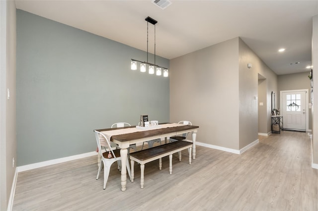 2426 Gentle Breeze Ln, Baytown, TX 77523 - dining room with light wood-style flooring and recessed lighting