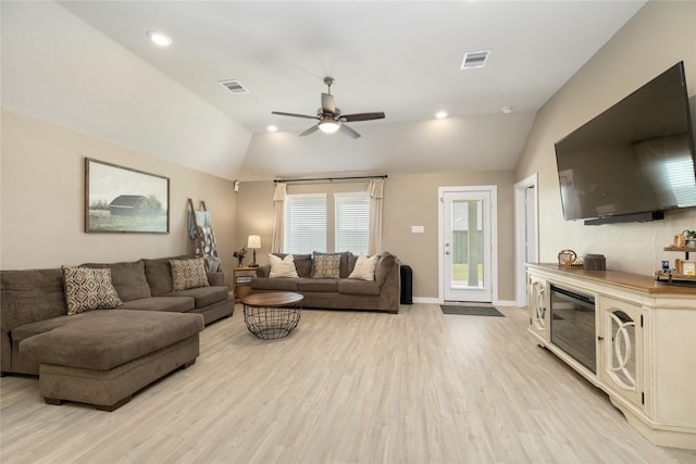 2426 Gentle Breeze Ln, Baytown, TX 77523 - living room with vaulted ceiling, light wood finished floors, ceiling fan, and recessed lighting