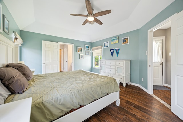 3282 Bend Cove Ct, League City, TX 77573 - bedroom featuring a raised ceiling, dark wood-style floors, and a ceiling fan