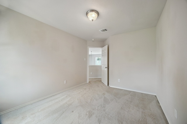 3282 Bend Cove Ct, League City, TX 77573 - spare room featuring baseboards and light colored carpet