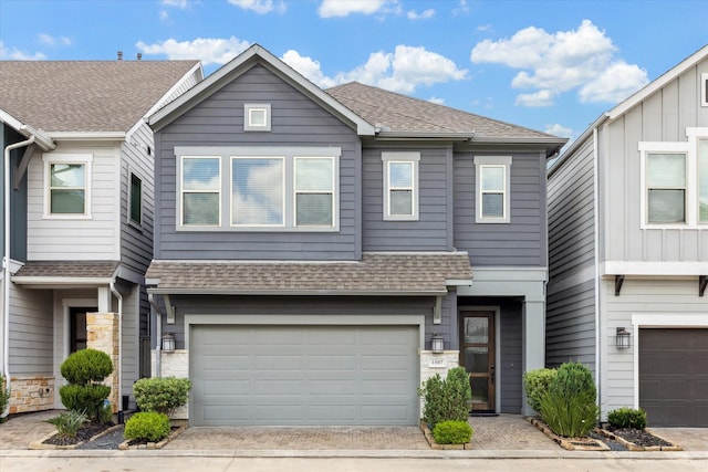 1507 Biondo Way, Houston, TX 77008 - view of property featuring a shingled roof, a garage, stone siding, and driveway
