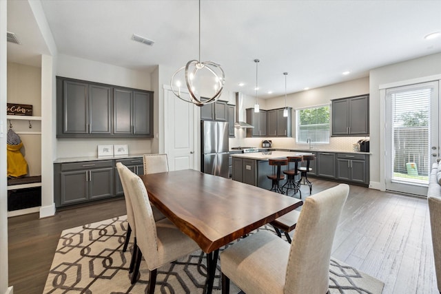1507 Biondo Way, Houston, TX 77008 - dining area with dark wood-type flooring, a chandelier, and recessed lighting