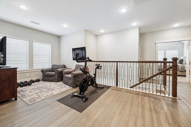 1507 Biondo Way, Houston, TX 77008 - workout room featuring wood finished floors, healthy amount of natural light, and recessed lighting